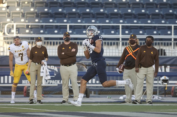 Nevada tight end Cole Turner hauls in a 50-yard touchdown reception during the first half of Nevada&#039;s 37-34 OT win over Wyoming to open the 2020 season. 