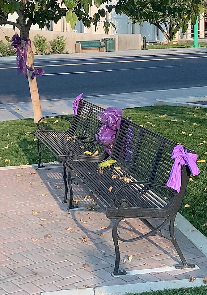 Purple bows decorate Millennium Park as part of Domestic Violence Awareness Month.