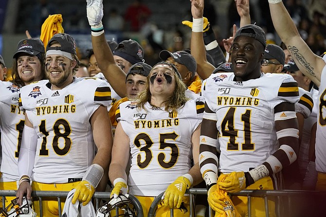 Wyoming quarterback Tyler Vander Waal (18), Skyler Miller (35), Davon Wells-Ross (41) in the second half during the Arizona Bowl college football game against Georgia State, Tuesday, Dec. 31, 2019, in Tucson, AZ. 