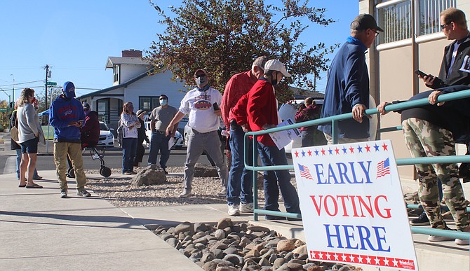 Early voters began lining up at the door at 8:30 a.m. Saturday to cast their votes in person.