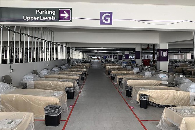 Hospital beds sit inside Renown Regional Medical Center&#039;s parking garage, which has been transformed into an alternative care site for COVID-19 patients in Reno, Nev., on Wednesday, Nov. 11, 2020. The center began moving some coronavirus patients into its parking garage. 