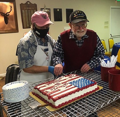 A.J. Matule and Bill Kell, the oldest veteran at the event, cake.  