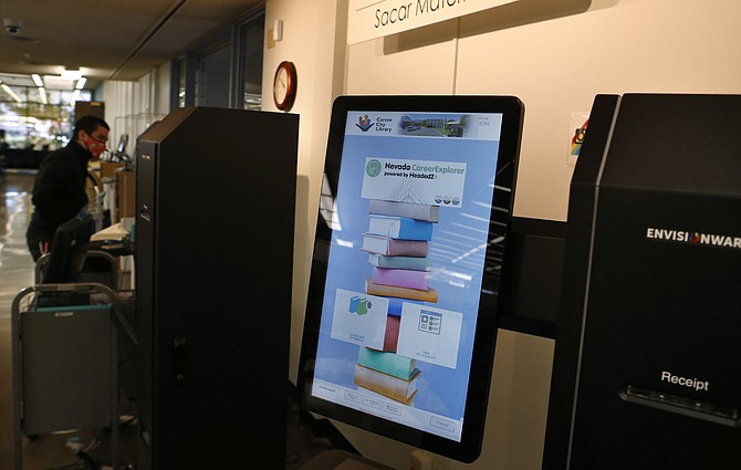 Carson City Library staff set up new self-check kiosks on Wednesday, Nov. 4, 2020. 
