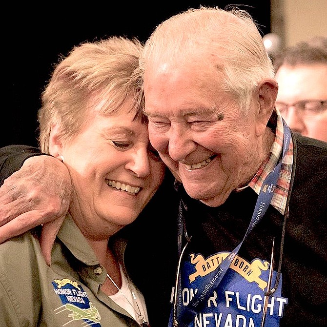 Jerry Smith, who participated in an Honor Flight Nevada trip to Washington, D.C., in 2015, hugs volunteer Dee Anthony.