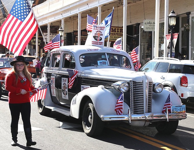 Vehicles and walkers show their patriotism during the 2019 Veterans Day parade in Virginia City.
