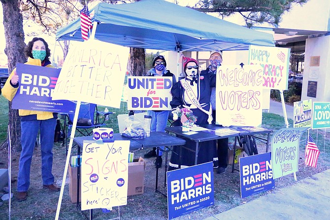 The Carson City Democrats, including Lisa Rea, Foxy Fisher and Sarah Adler, show their support for candidates Joe Biden and Kamala Harris near the Carson City Community Center where voting took place on Election Day Tuesday.