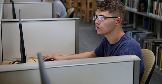 Matthew Knight works in the library at Western Nevada College in Fallon, Nev., on Monday, April 22, 2019.
Photo by Cathleen Allison/Nevada Momentum