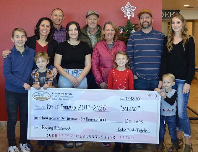 Since its inception since 2011, the Pay It Forward program from Fallon Ford-Toyota has donated $361,650 to area nonprofit organizations. From left are Ember, Chris, Kurt, Debi, Clint and Tiffani and their children.