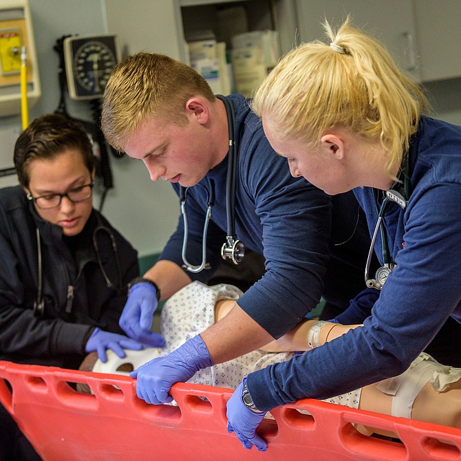 From left, Asyah Williams, Kyle Miller, and Kelsey Hein work in an EMS class at Western Nevada College in Carson City, Nev., on Thursday, March 28, 2019. 