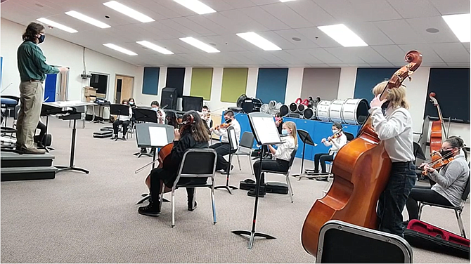 Eagle Valley Middle School Orchestra students, led by Orchestra Director Dr. Brian Fox, perform holiday concerts last week to be posted online