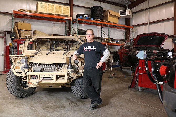 Chad Hall, owner of Rod Hall Products in Sparks, stands next to a U.S. military ground mobility vehicle with a suspension upgrade provided by Rod Hall Products.