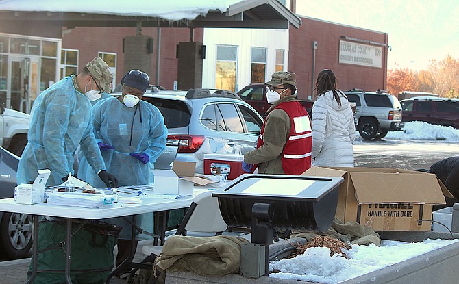 National Guardsmen aid Carson City Health and Human Services at a coronavirus clinic in Gardnerville on Tuesday.
