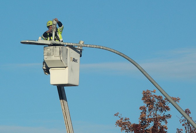 You could say this was light work on Tuesday as a worker takes to a cherrypicker at Main Street and Waterloo. Expect Minden and Gardnerville to take to their bucket trucks in the next while to start hanging Christmas decorations.