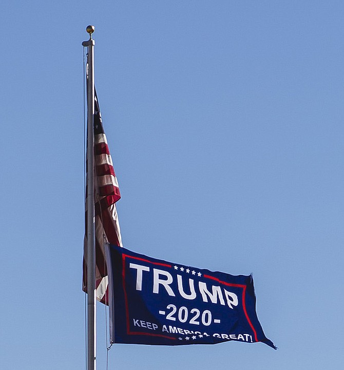A flag supporting President Trump flies at the intersection of Highway 88 and Mottsville Lane. The president received 63.3 percent of the vote in Douglas County.
