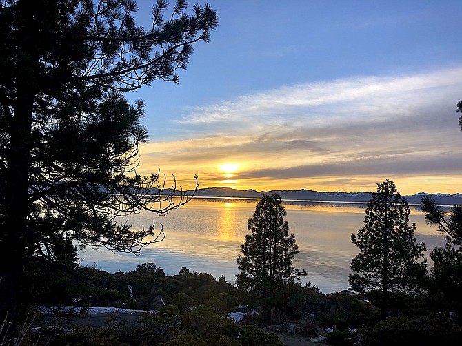 The sun sets over Lake Tahoe, much as it will set tonight on 2020.