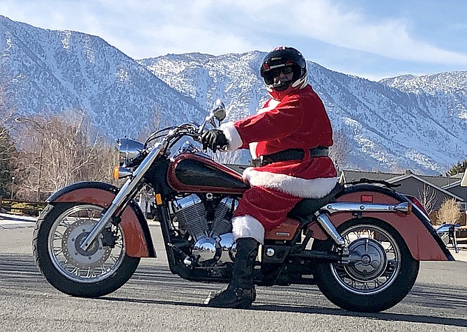 Santa rides a motorcycle in Carson Valley.