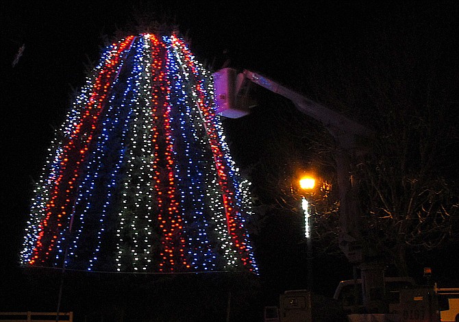 Gardnerville Public Works Superintendent Geoff LaCost works on the town&#039;s Christmas tree Thursday night.