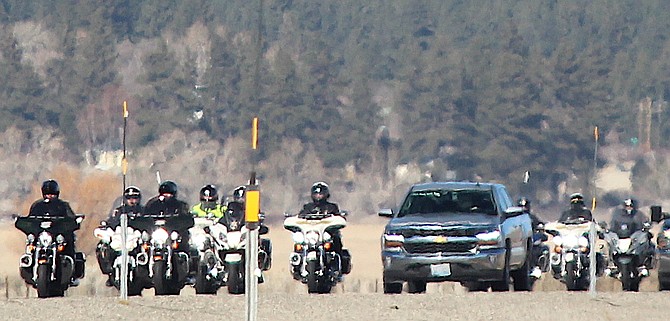 A motorcade escorts Sgt. John Lenz home  through Washoe Valley from the hospital on Tuesday.