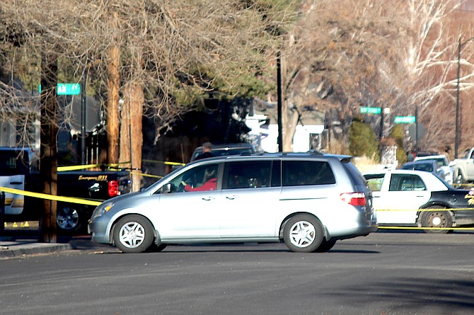 A van turns around on Douglas Avenue after seeing Gillman is closed.