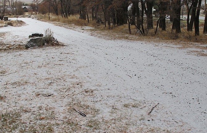 Snow sticks to a dirt road on Sunday morning. Carson Valley residents awoke on Monday to a similar sight.