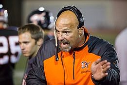 An animated Rod Smalley gives instructions on the Douglas High sidelines. 