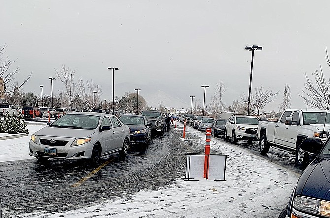 Vehicles line up at a vaccination event on Saturday.