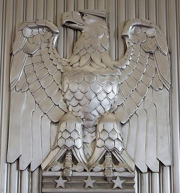 An eagle and other caste aluminum details decorate the main floor of the historic  U.S. Post Office.