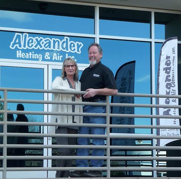 Linda and Victor Alexander in front of their new company headquarters in Sparks.