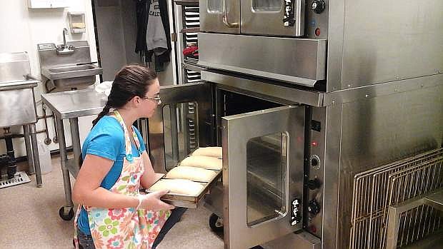 Kristen Coblentz makes bread in the Lattin Farms kitchen. She took over the Breadgirl business from her sister Melissa Coblentz.