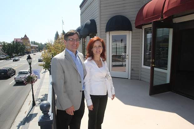 Carson City Square professional building owners Steve and Wendy Kaplan stand on a deck, that is accessed through an vacant office space.