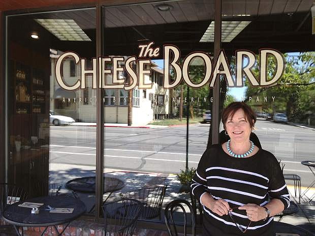 Founder and President of The Cheese Board American Bistro &amp; Catering Company Debbie Brandy stands outside the business she started 35 years ago.