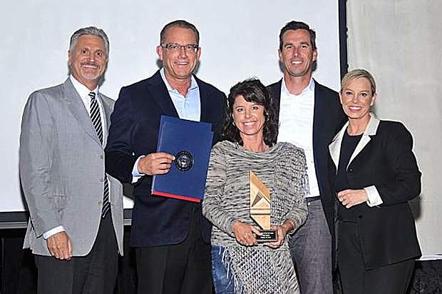 Shown from left to right are: Washoe County Commissioner Vaughn Hartung, Duane Andrews, Sarah Lambert and Kevin Marshall from Clear Capital, and Reno Mayor Hillary Schieve.