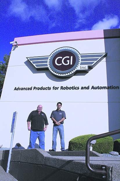 Michael Batrich, quality assurance manager at CGI (left) and Gil Tapia, WNC student and full time CGI quality inspector, are seen outside the company&#039;s machine shop in Carson City.