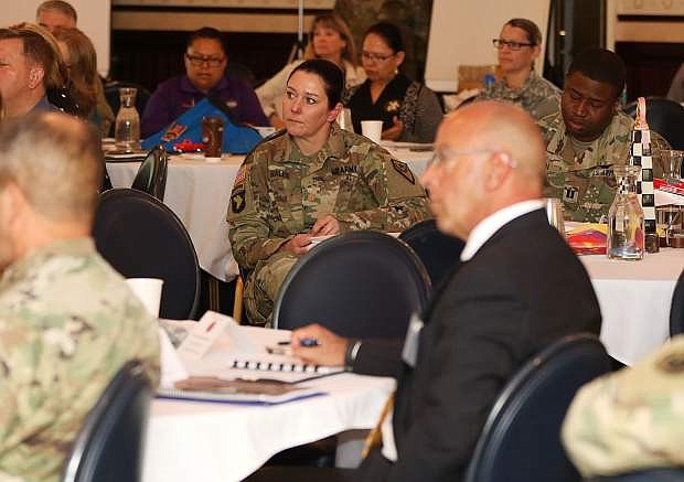 Nevada National Guard Maj. Christy Hales listens to a speaker at the Beyond the Yellow Ribbon Invitational Summit Wednesday morning at the Governor&#039;s Mansion. The summit was to help collaborate and share ideas for how to reduce military and veteran unemployment across the country.