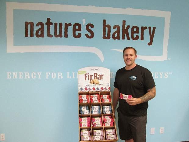 Sam Marson at the reception area of the company&#039;s warehouse. Fig bar samples are always on offer for visitors.