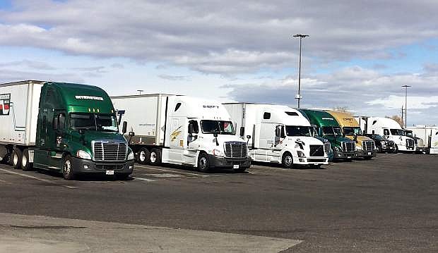 Trucks are lined up at the Alamo Petro Stopping Center in east Sparks while drivers take a break.