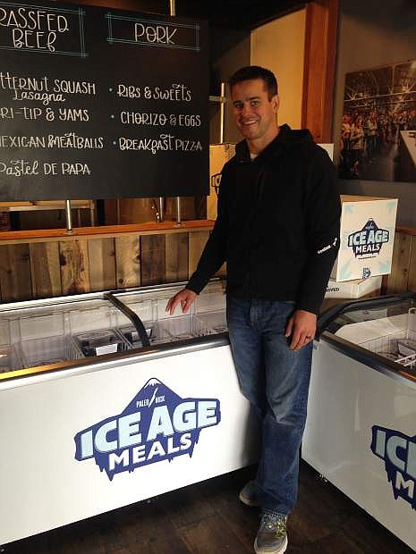 Nick Massie, also known as Paleo Nick, stands in front of a case of Ice Age Meals at his Reno facility. Ice Age Meals are frozen Paleo meals that are shipped to homes across the country.