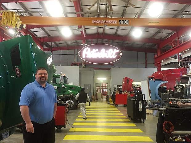 Shawn D. Gallagher, fixed operatins manager for Peterbilt Truck Parts &amp; Euipment, LLC, shows off the company&#039;s vehicle service center.