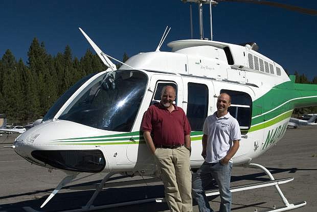 Claudio Bellotto, owner of Reno Tahoe Helicopters, with future pilot Joshua Allen.