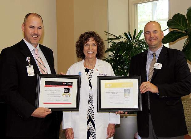 Erik Olson, vice president and CEO of Renown Regional Medical Center, left, Karen Meskimen, director of cardiovascular clinical programming for Renown Institute for Heart &amp; Vascular Health, and Mick Smith, American Heart and Stroke Association, are seen with AHA awards recognizing Renown for its high quality heart care.