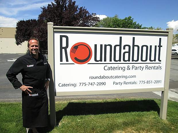 Colin Smith stands outside his Roundabout Catering facility, a venture he operates with his wife MaryBeth.