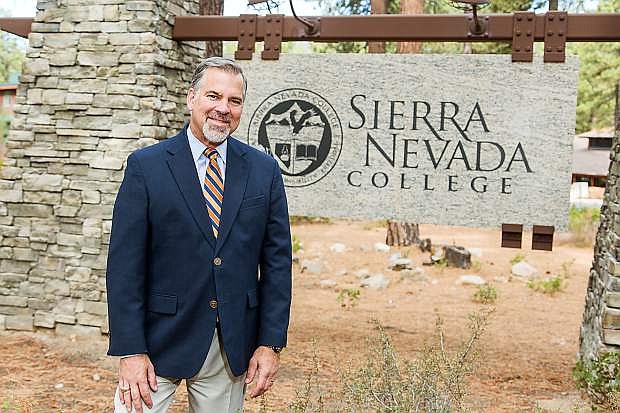 Alan Walker at the entrance to Sierra Nevada College in Incline Village.