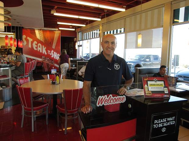 Eric Vetter stands ready to welcome customers at the Reno Stake &#039;n Shake.