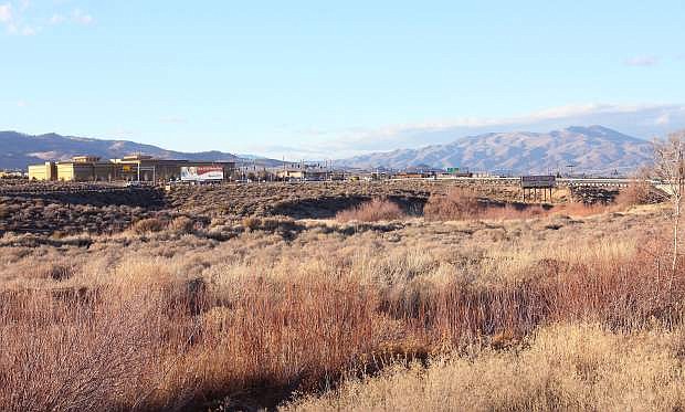 This 101-acre parcel at Highway 395 and Geiger Grade, which includes Steamboat Creek, foreground, is slated for mixed-use commercial and residential development.