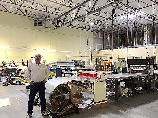Auguste Lemaire, President of Sunvelope, stands in their manufacturing facility in Sparks.