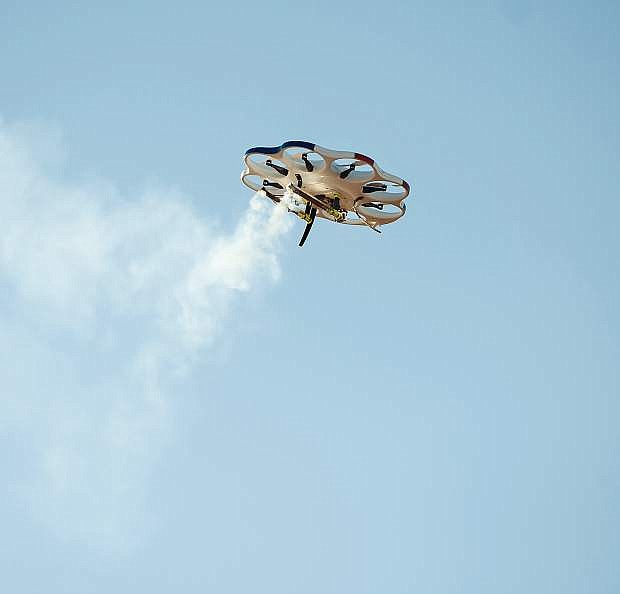 Drone America&#039;s DAx8 multi-rotor aircraft performs a cloud seeding flare test in January at the RC field in Spanish Springs. The project is in partnership with the Desert Research Institute and AviSight.