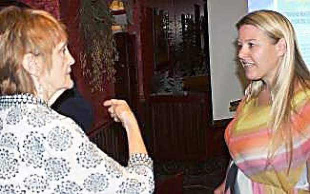 Abbi Whitaker, right, of the Abbi Agency in Reno, speaks with local businesswoman Patrica Sammons after a recent CEDA breakfast.