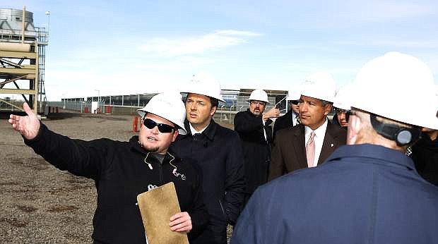 Brian Stankiewicz, left, gives on Tuesday Italian Prime Minister Matteo Renzi, center, and Nevada Gov. Brian Sandoval a tour of the Stillwater Hybrid Power Plant.