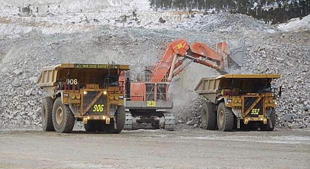 Heavy equipment move dirt at the Lone Canyon mine.