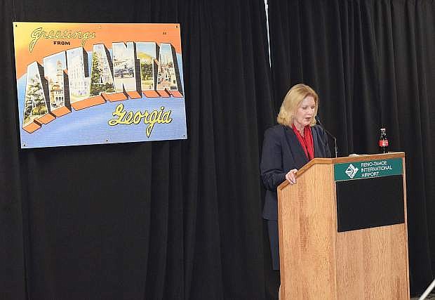 Marily Mora, president/CEO of the Reno-Tahoe Airport Authority, speaks to those gathered for the return of Delta Airlines&#039; direct flights between Reno and Atlanta.